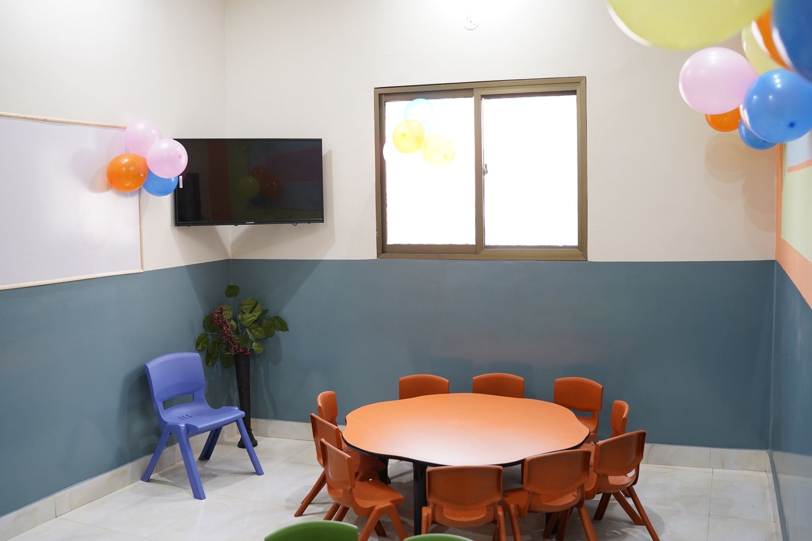 Early-years classroom with child-sized table and chairs
